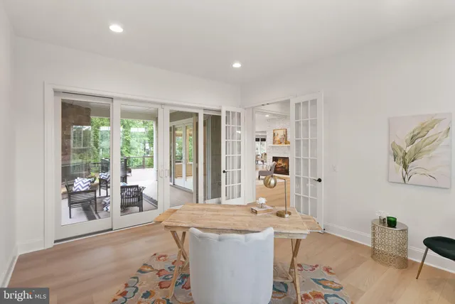 a view of swimming pool with outdoor seating and deck