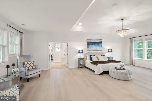 a view of a house with a big yard and a large tree