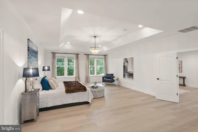 an aerial view of residential houses with outdoor space and street view