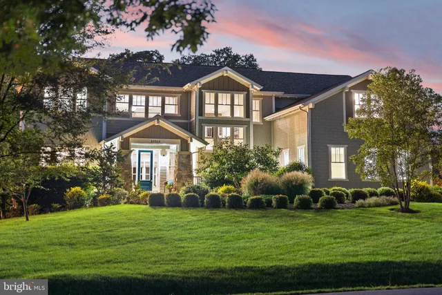 a living room with furniture a large window and dining table