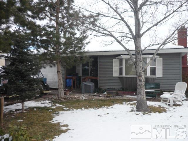 1550 Harvard Way Reno, NV 89502 - Photo 1 of 1 a view of a house with snow on the road