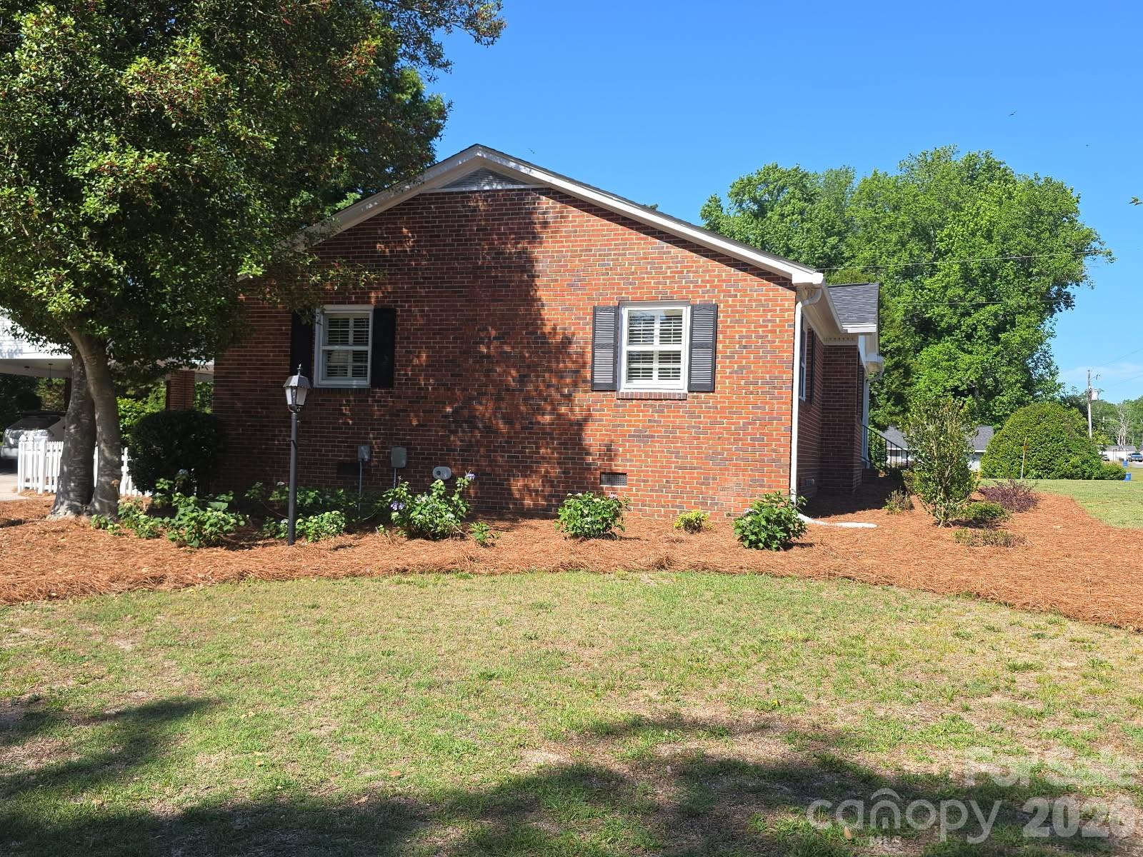313 Pigg Street Pageland, SC 29728 - Photo 7 of 48 a front view of a house with a yard