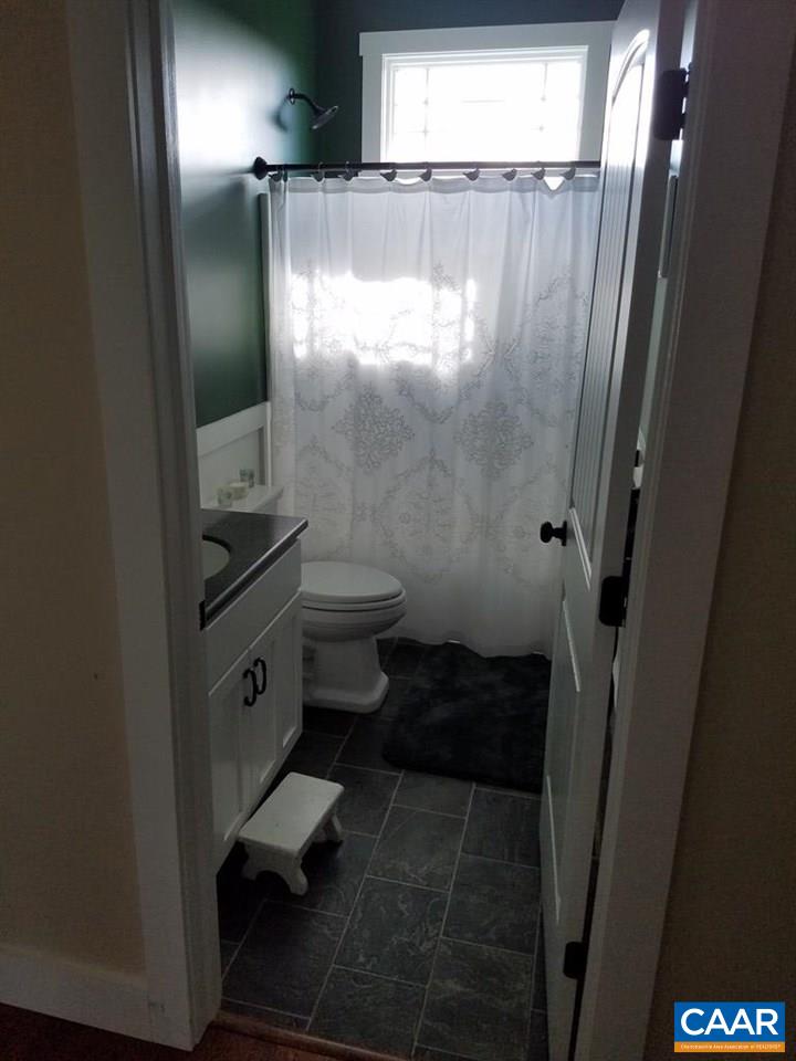 913 Plank Road Farmville, VA 23901 - Photo 13 of 16 a bathroom with a toilet and a shower