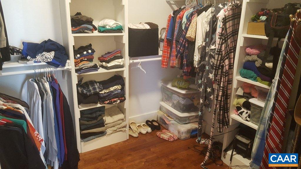 913 Plank Road Farmville, VA 23901 - Photo 10 of 16 a view of walk in closet with clothes and shoes