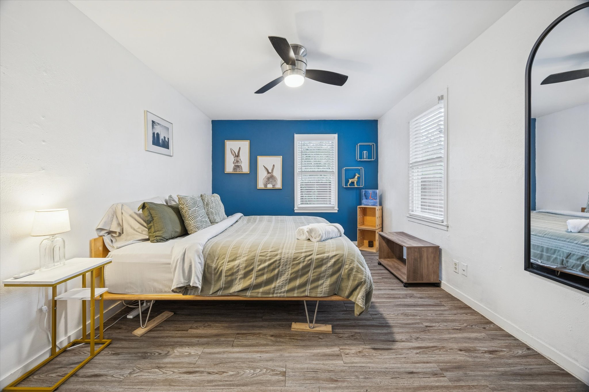 211 Lessin Lane, Unit C Austin, TX 78704 - Photo 12 of 14 a bedroom with a bed and wooden floor