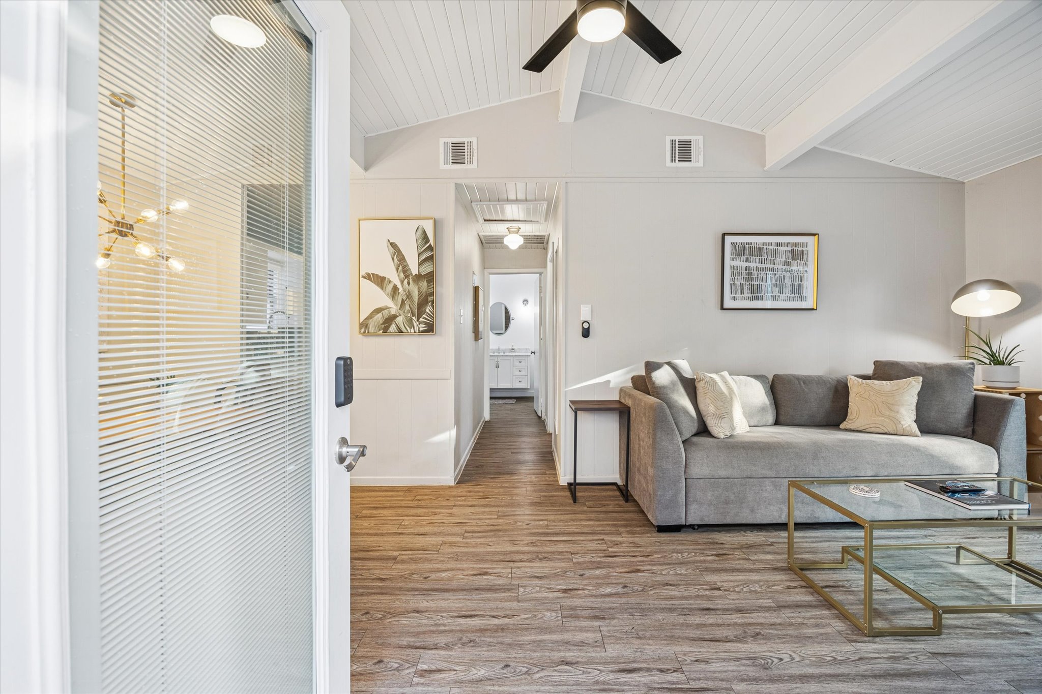 211 Lessin Lane, Unit C Austin, TX 78704 - Photo 5 of 14 a living room with furniture and a wooden floor