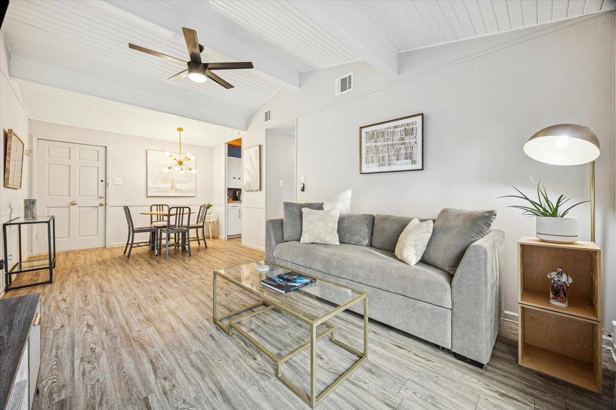 211 Lessin Lane, Unit C Austin, TX 78704 - Photo 7 of 14 a living room with furniture and a wooden floor