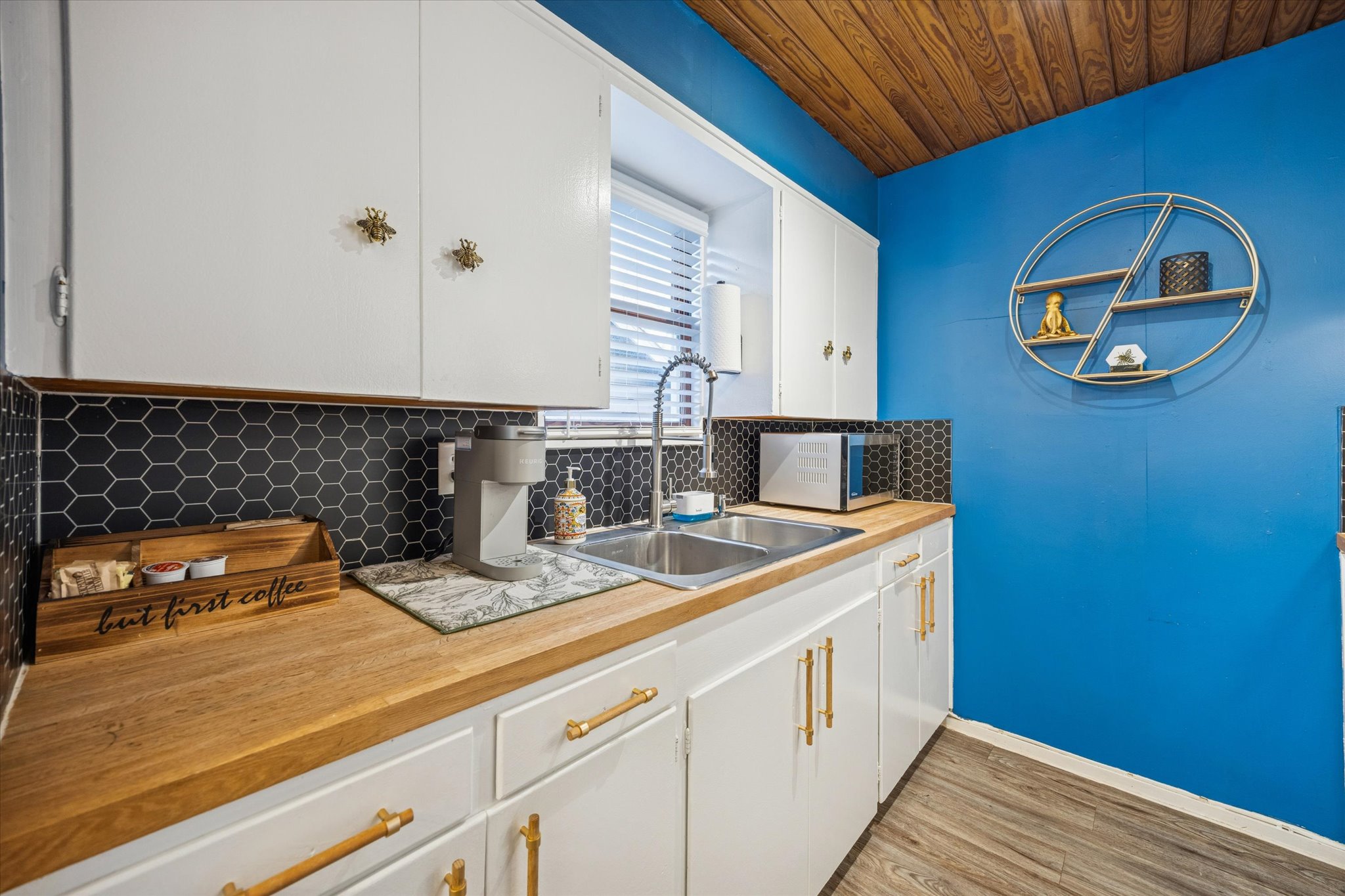 211 Lessin Lane, Unit C Austin, TX 78704 - Photo 10 of 14 a kitchen with a sink and cabinets