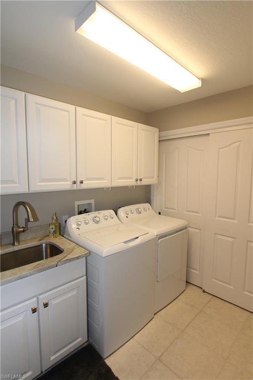 5770 Grande Reserve Way, Unit 1501 Naples, FL 34110 - Photo 12 of 18 a view of a sink and dishwasher with cabinets