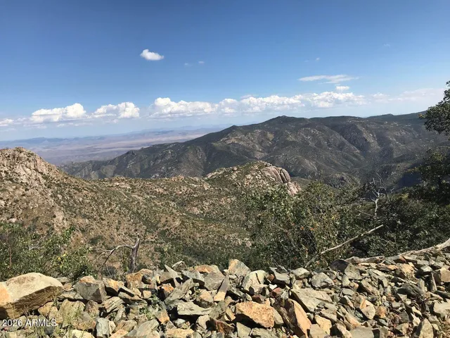 a view of a city of mountains and an ocean