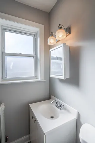a bathroom with a sink and a toilet