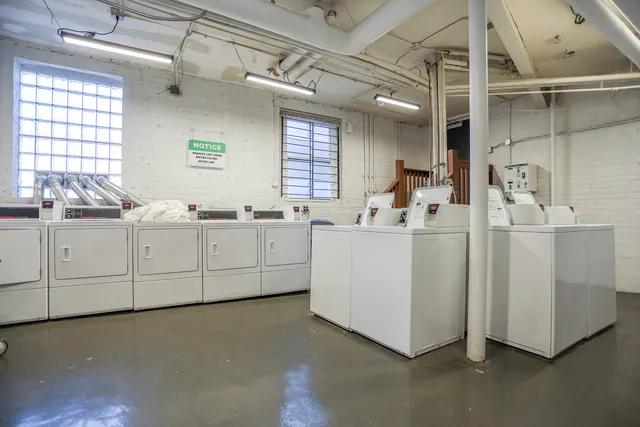a kitchen with cabinets a sink and appliances