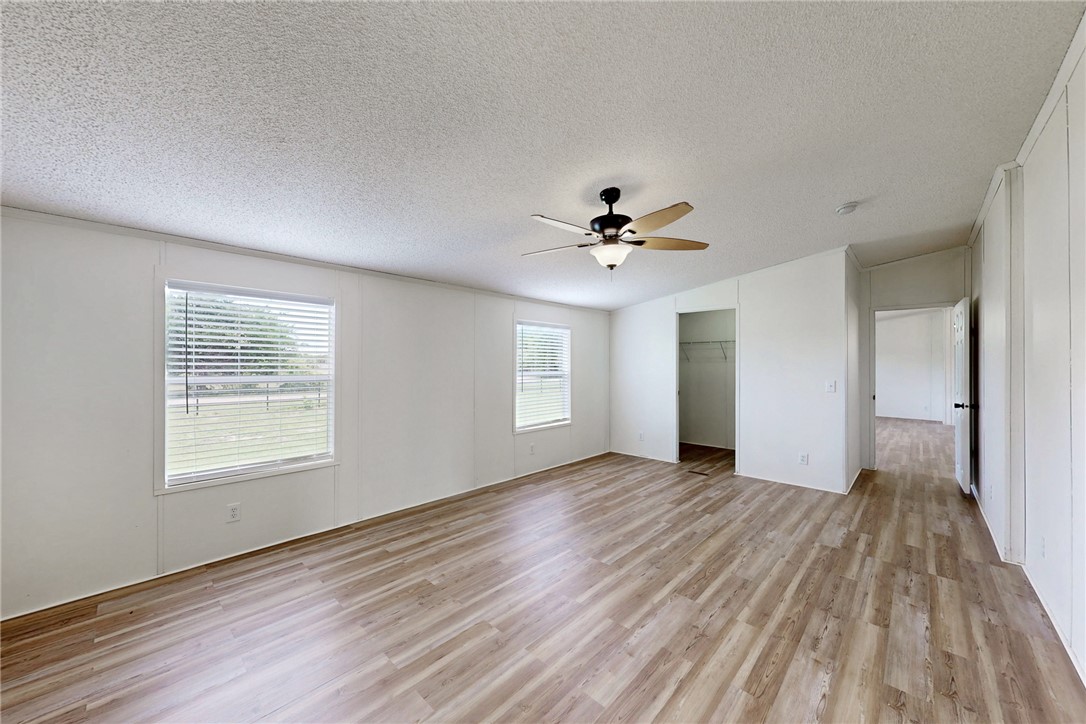 11459 Winstead Lane Calvert, TX 77837 - Photo 19 of 37 a view of an empty room with wooden floor and a window