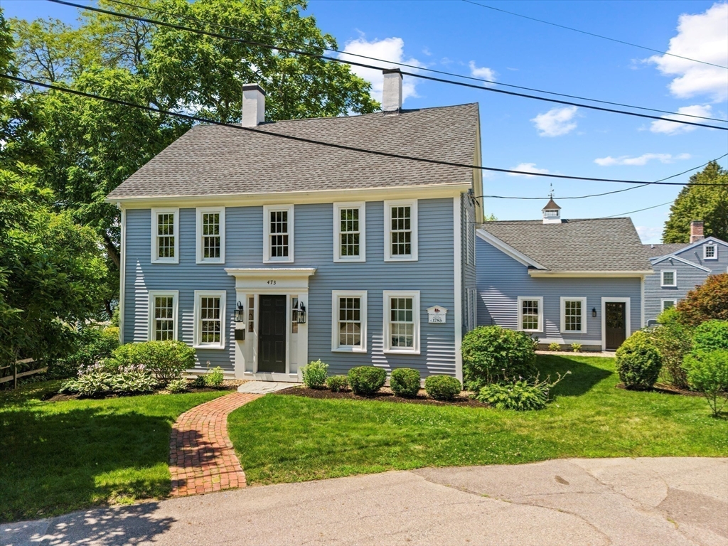 473 Main Street Amesbury, MA 01913 - Photo 14 of 42 a front view of a house with a yard