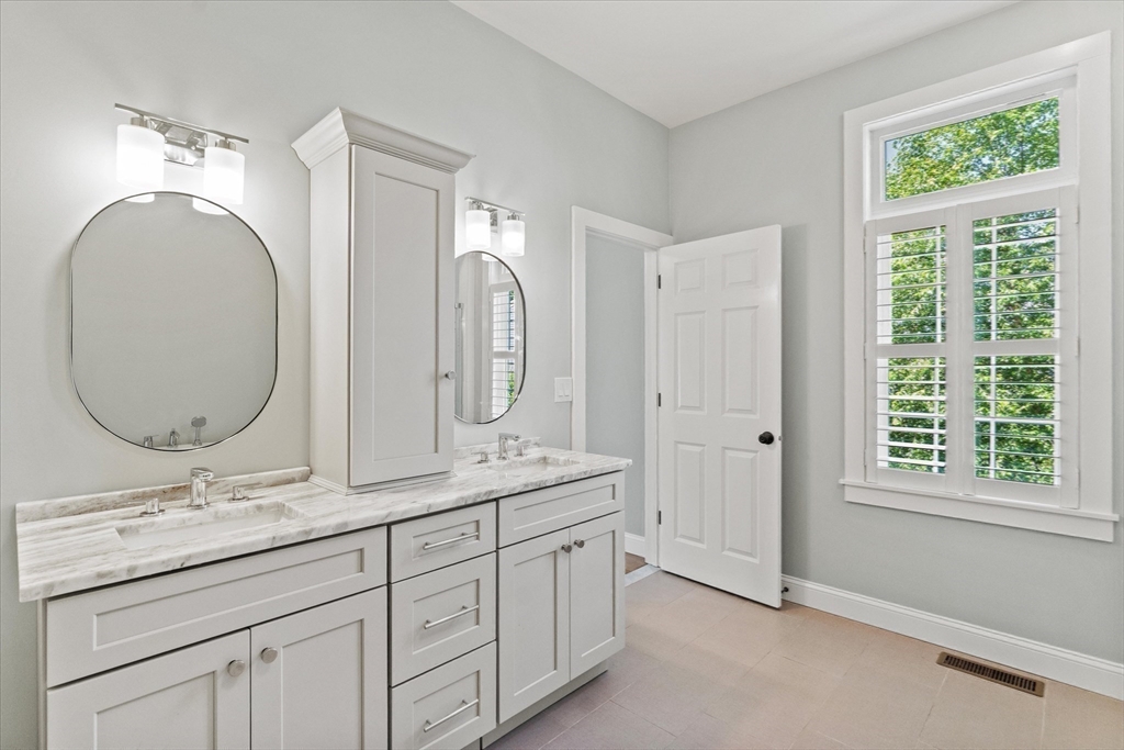 473 Main Street Amesbury, MA 01913 - Photo 25 of 42 a bathroom with a double vanity sink and a mirror