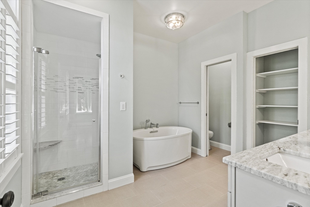 473 Main Street Amesbury, MA 01913 - Photo 26 of 42 a bathroom with a tub sink mirror and shower