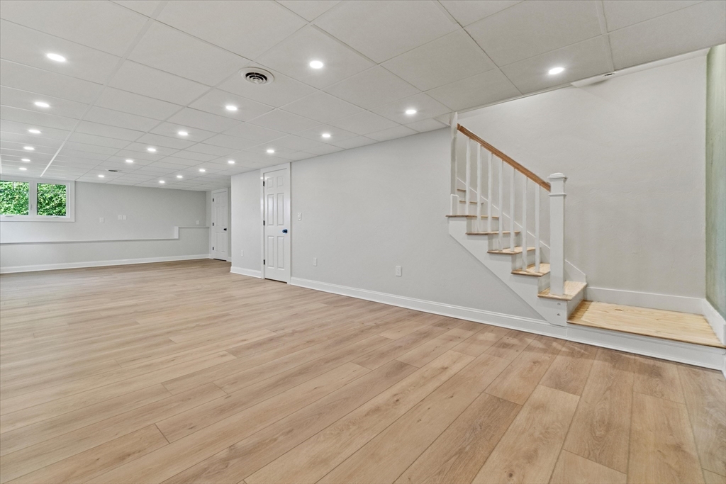 473 Main Street Amesbury, MA 01913 - Photo 37 of 42 a view of an empty room with wooden floor