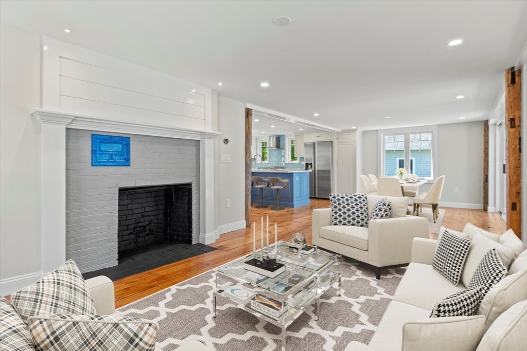 473 Main Street Amesbury, MA 01913 - Photo 9 of 42 a bedroom with furniture and a fireplace