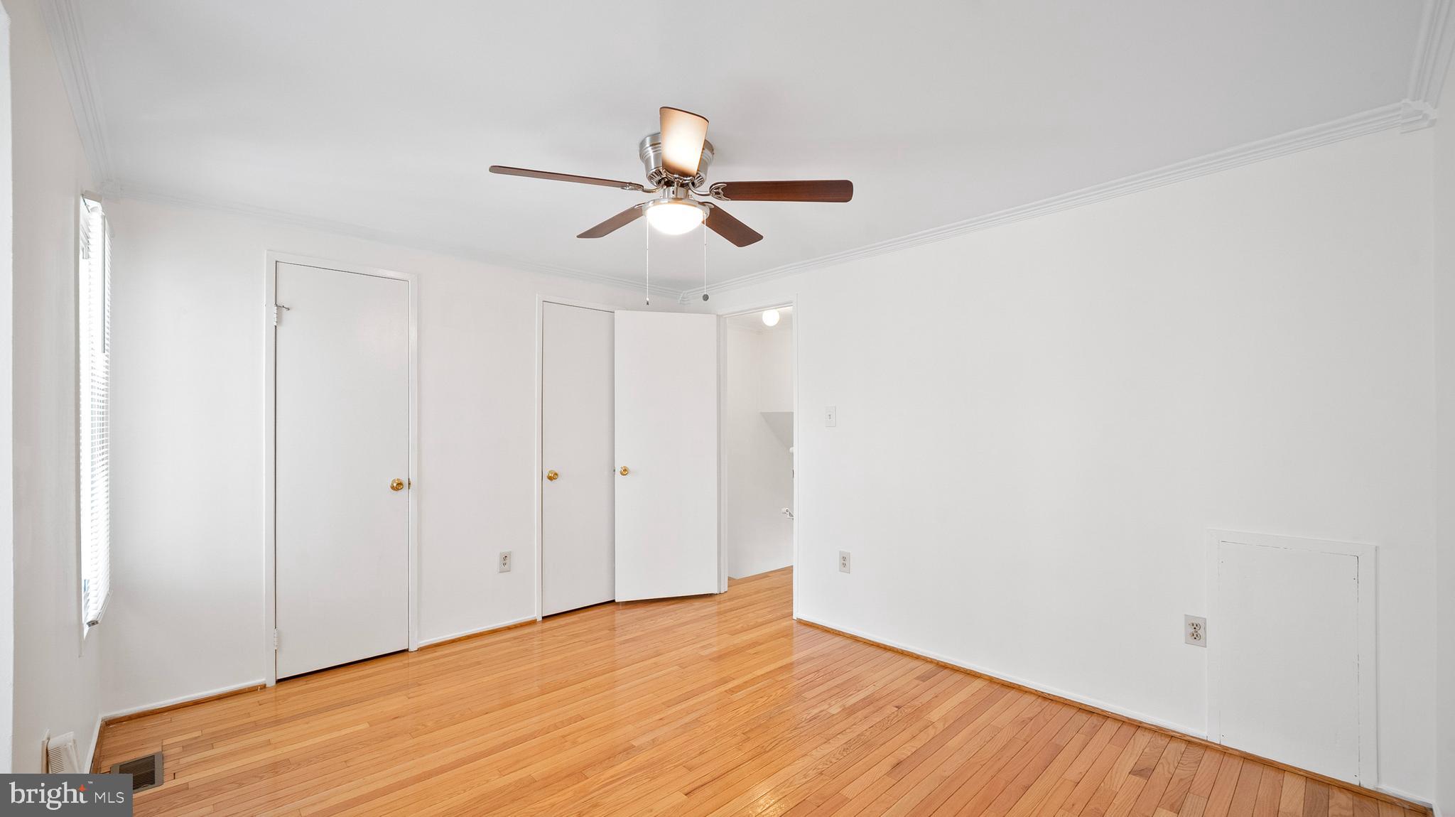 10710 Lester Street Silver Spring, MD 20902 - Photo 14 of 24 a view of empty room with wooden floor