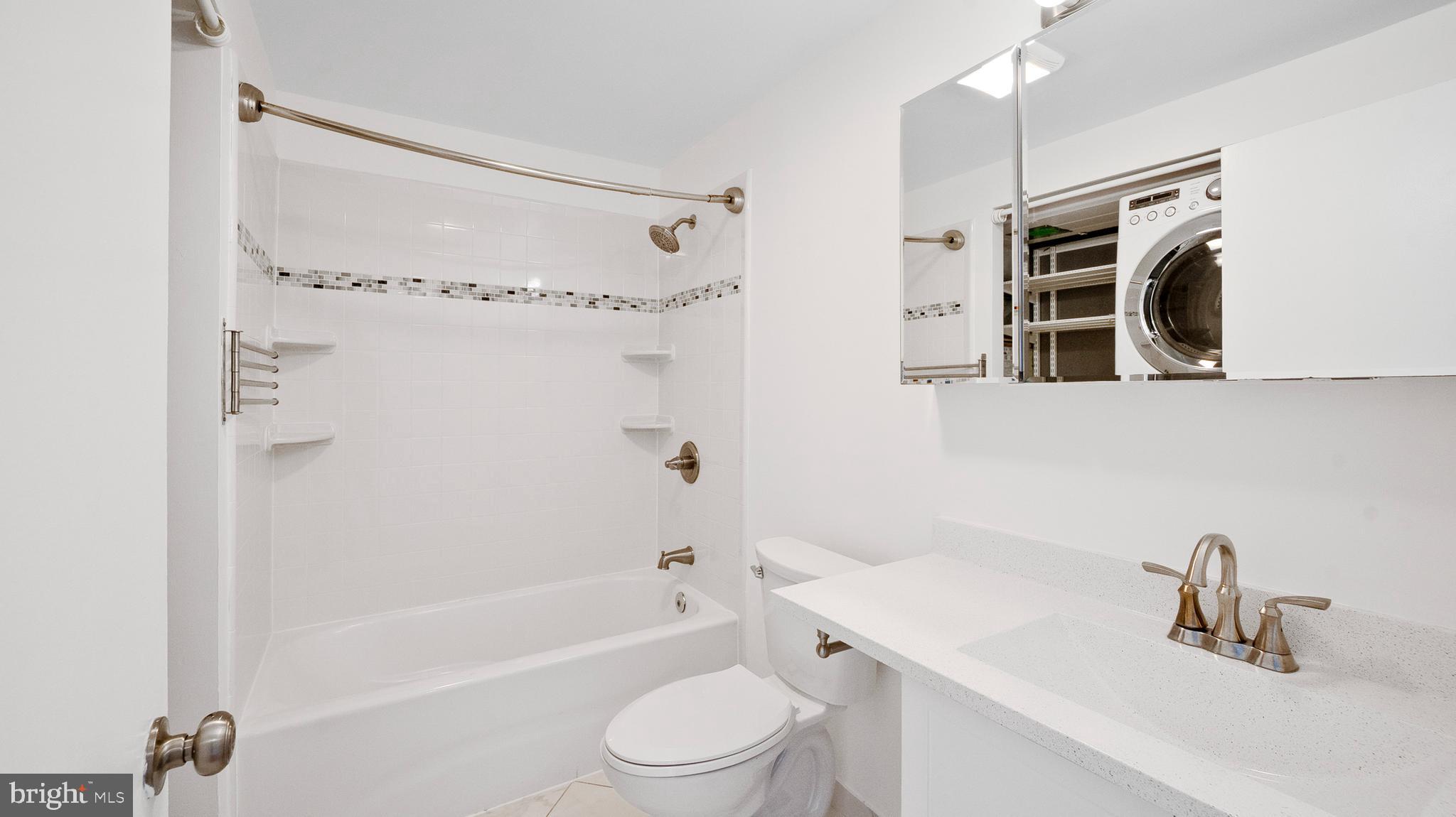 10710 Lester Street Silver Spring, MD 20902 - Photo 15 of 24 a bathroom with a sink a toilet and shower
