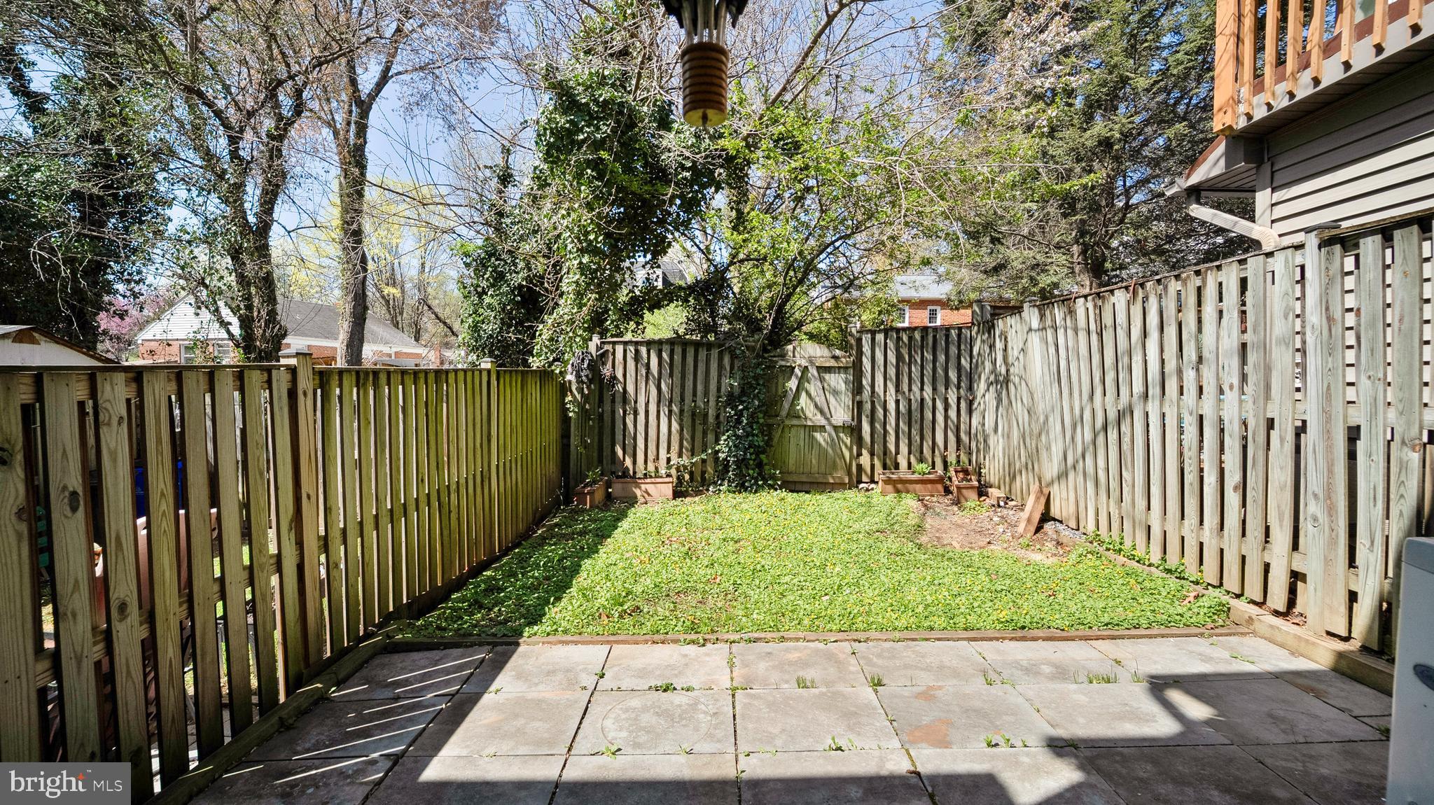 10710 Lester Street Silver Spring, MD 20902 - Photo 20 of 24 a view of a backyard with wooden fence