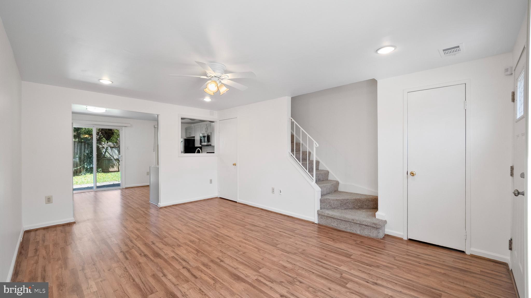 10710 Lester Street Silver Spring, MD 20902 - Photo 4 of 24 wooden floor in an empty room with a window