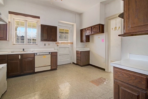 26 MacArthur Loop Highland Park, IL 60035 - Photo 36 of 47 a kitchen with cabinets a sink and white appliances