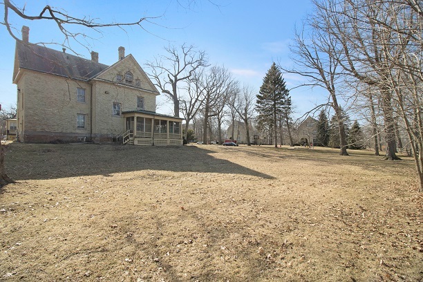 26 MacArthur Loop Highland Park, IL 60035 - Photo 37 of 47 a view of a large house with a yard