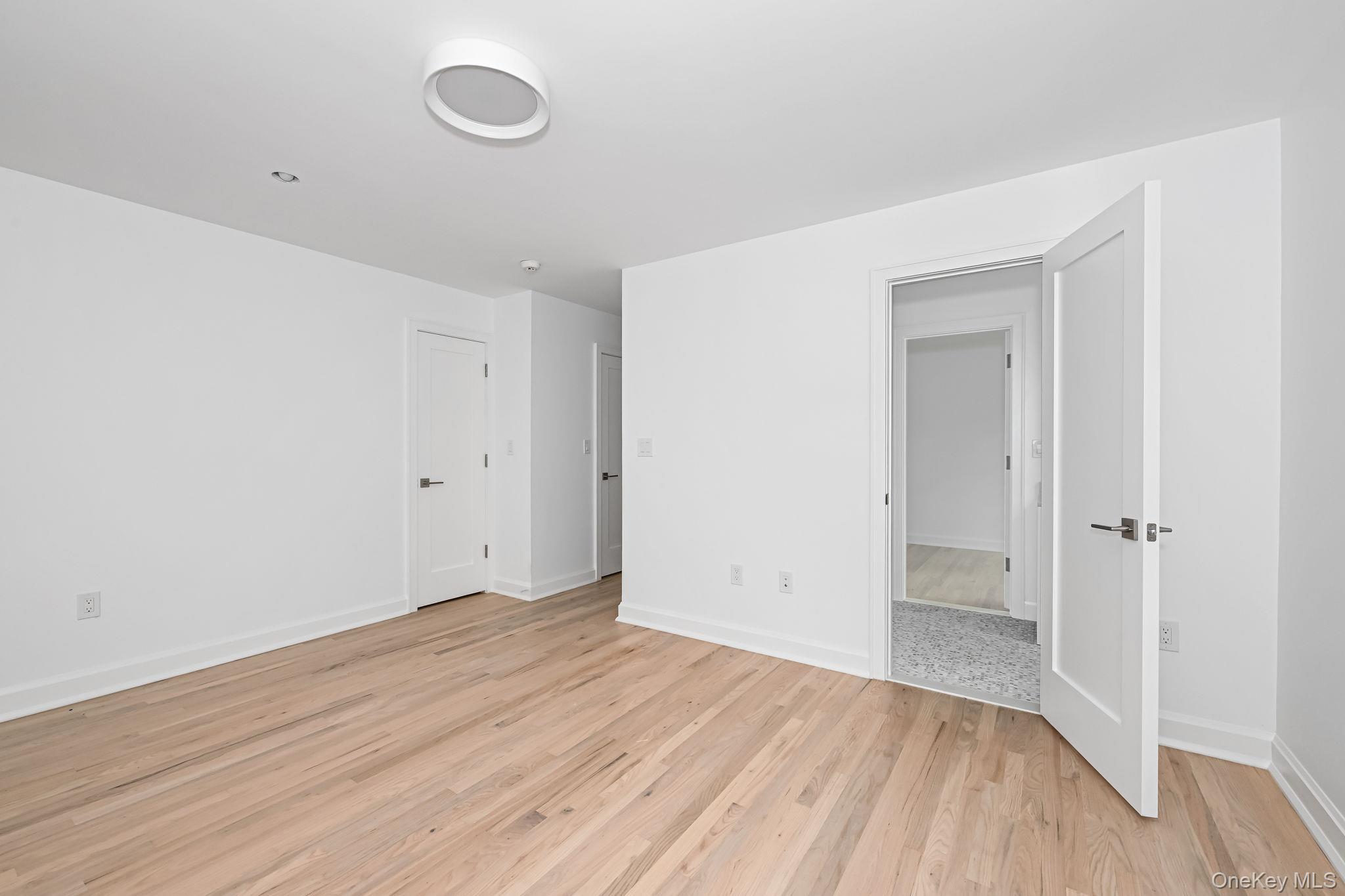 24 Country Road Mamaroneck, NY 10543 - Photo 21 of 37 wooden floor in an empty room