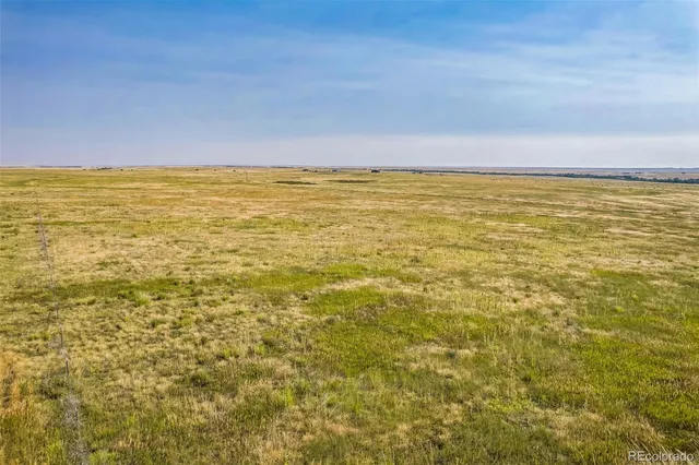 a view of beach with an ocean