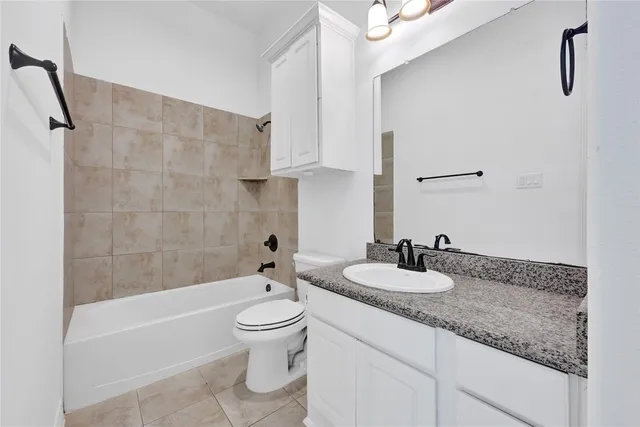 a view of kitchen with furniture and refrigerator