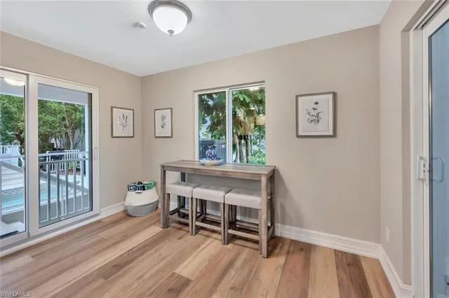 a view of a dining room with furniture window and outside view