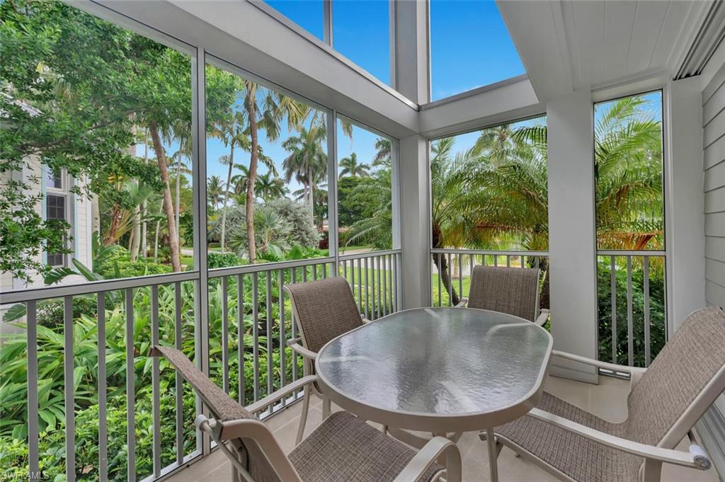 180 6th Avenue South, Unit 3 Naples, FL 34102 - Photo 17 of 44 a view of a dining room with furniture window and outside view