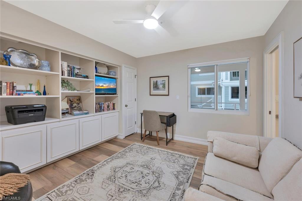 180 6th Avenue South, Unit 3 Naples, FL 34102 - Photo 18 of 44 a living room with furniture and a window