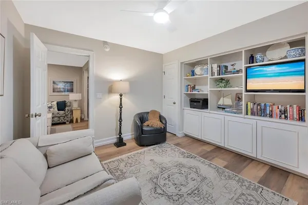 a living room with furniture and a window