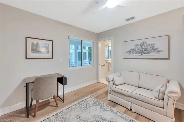 a bathroom with a granite countertop sink a mirror and a bathtub