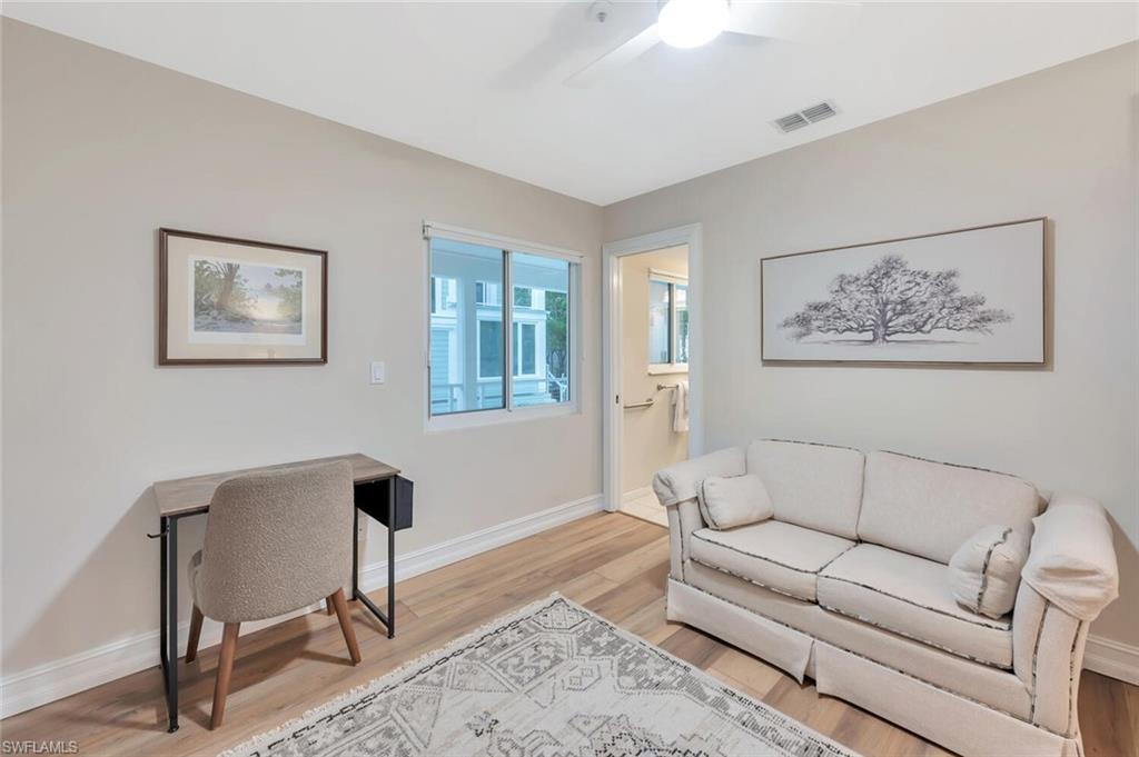 180 6th Avenue South, Unit 3 Naples, FL 34102 - Photo 20 of 44 a living room with furniture and a window