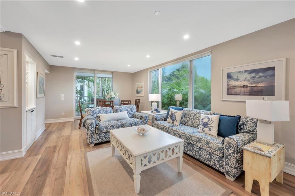 180 6th Avenue South, Unit 3 Naples, FL 34102 - Photo 3 of 44 a living room with furniture and a large window