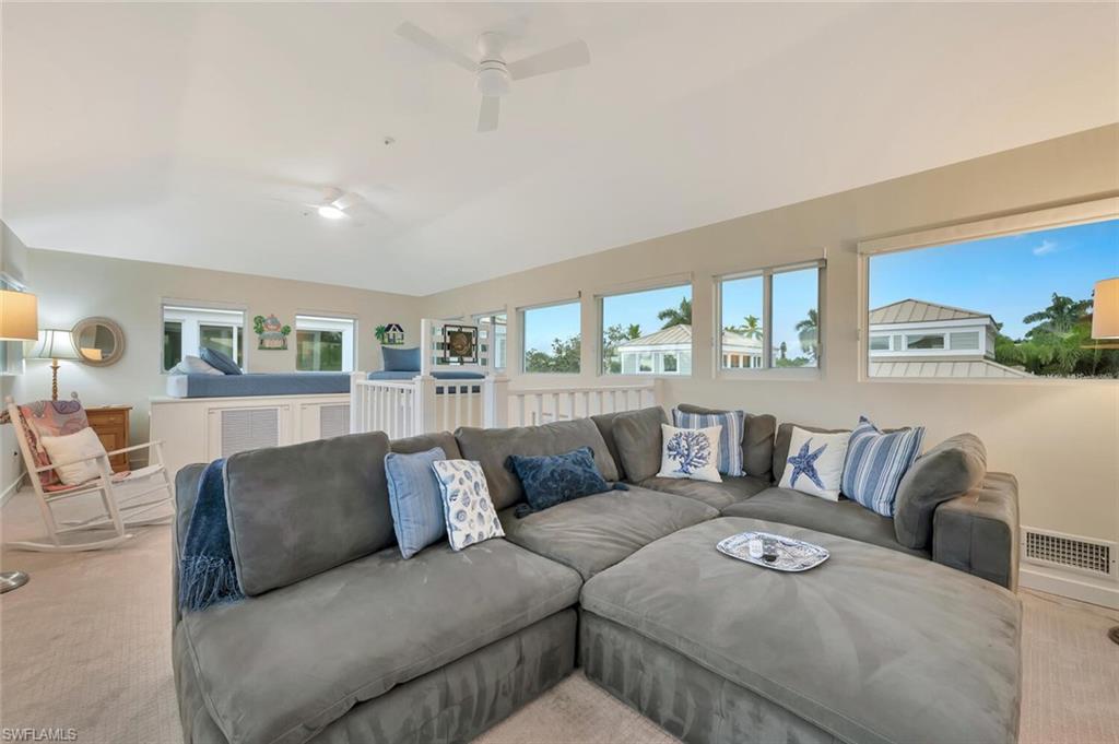 180 6th Avenue South, Unit 3 Naples, FL 34102 - Photo 33 of 44 a living room with furniture and a large window