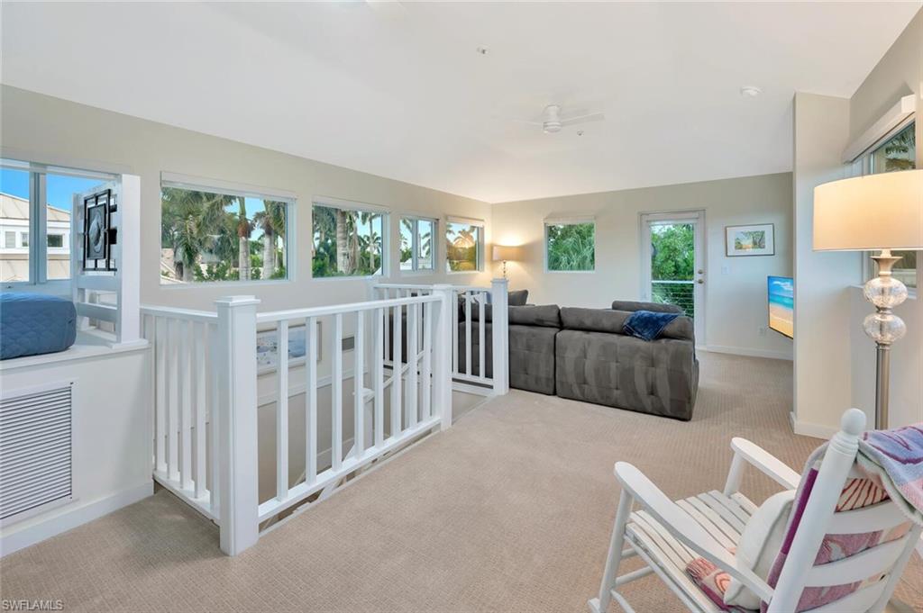 180 6th Avenue South, Unit 3 Naples, FL 34102 - Photo 35 of 44 a view of a living room and a wooden floor