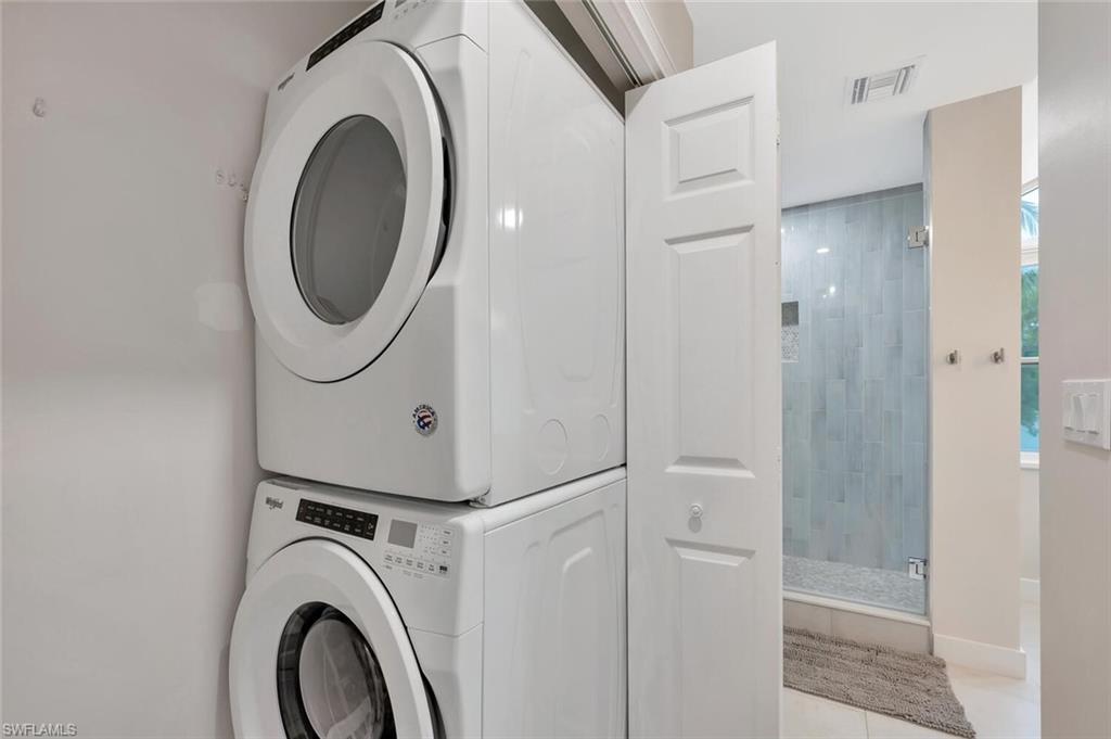 180 6th Avenue South, Unit 3 Naples, FL 34102 - Photo 38 of 44 a view of a hallway with washer and dryer