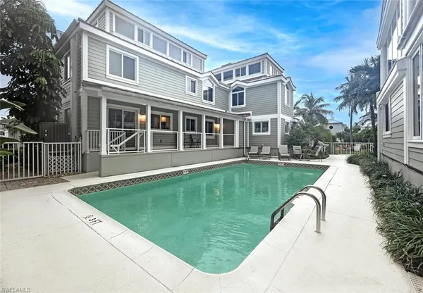 a view of a house with swimming pool