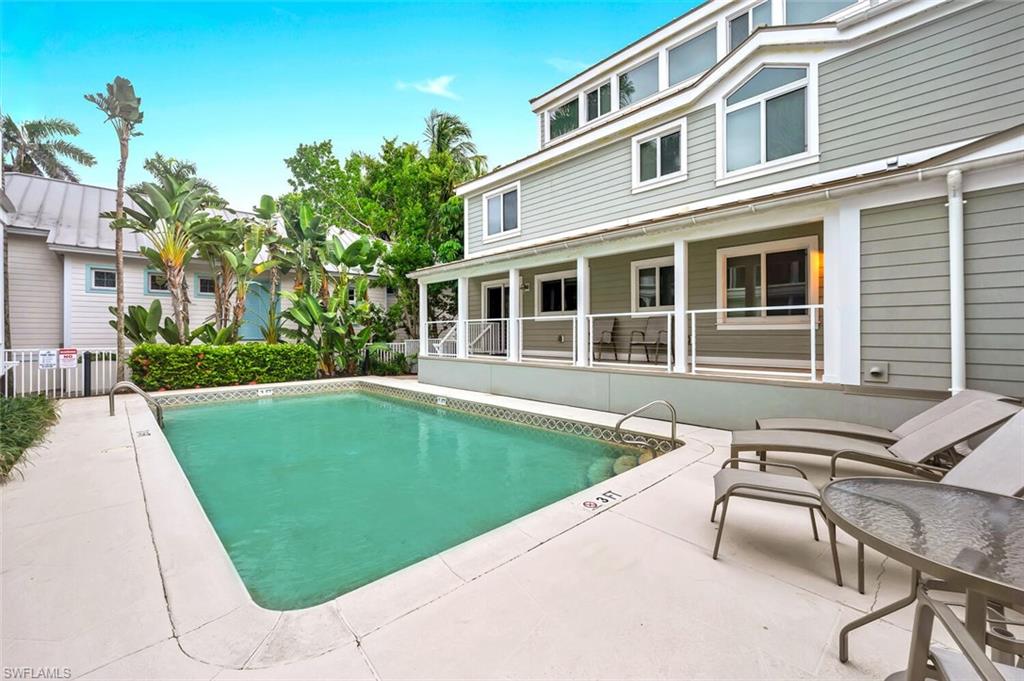 180 6th Avenue South, Unit 3 Naples, FL 34102 - Photo 40 of 44 a view of a house with swimming pool