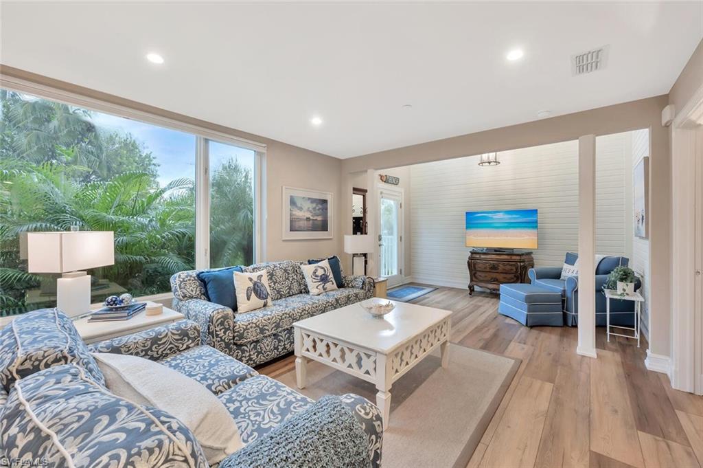 180 6th Avenue South, Unit 3 Naples, FL 34102 - Photo 4 of 44 a living room with furniture and a large window