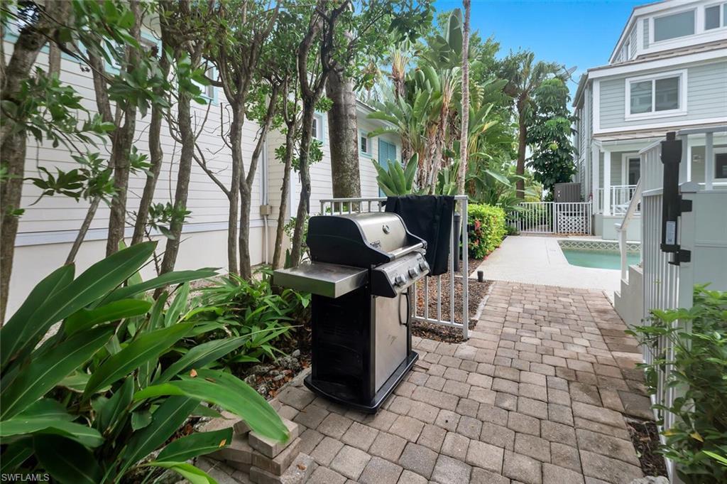 180 6th Avenue South, Unit 3 Naples, FL 34102 - Photo 41 of 44 a view of a garden with plants and large trees