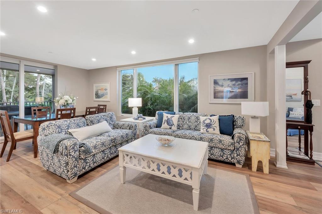 180 6th Avenue South, Unit 3 Naples, FL 34102 - Photo 5 of 44 a living room with furniture and a large window