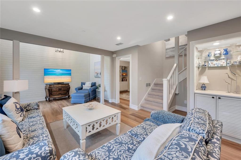 180 6th Avenue South, Unit 3 Naples, FL 34102 - Photo 6 of 44 a living room with furniture and a flat screen tv
