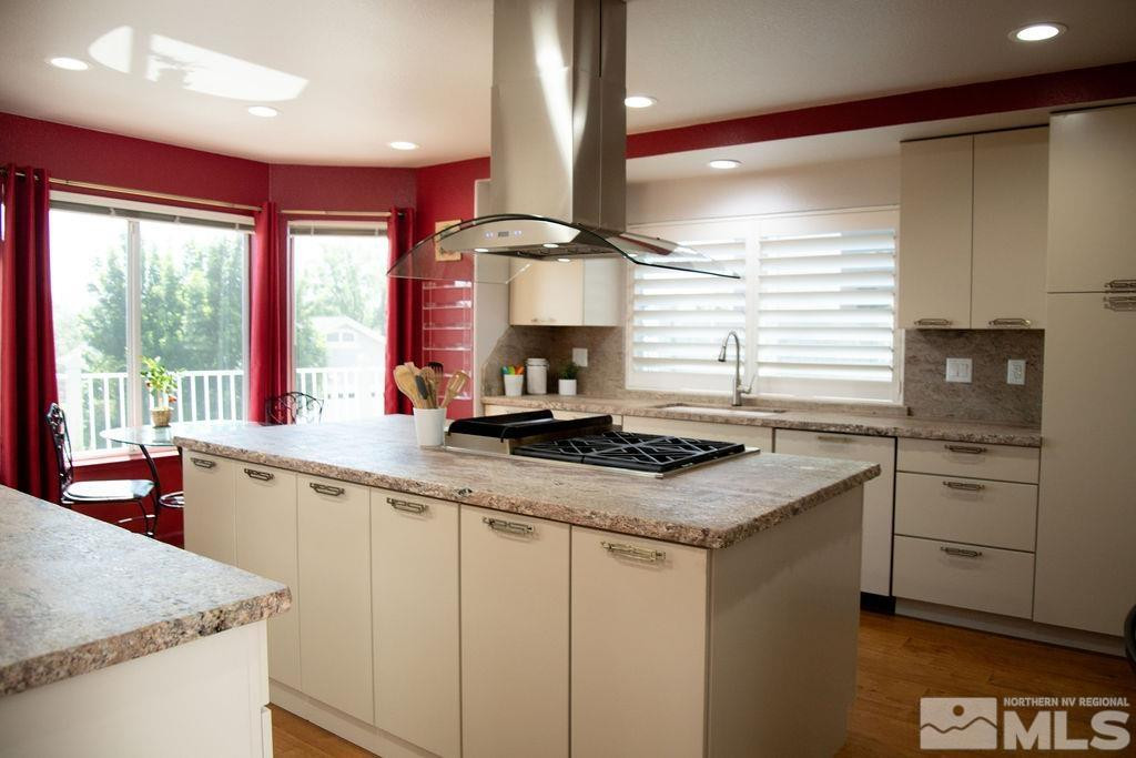 6174 Chaise Court Reno, NV 89519 - Photo 8 of 39 a kitchen with a stove a sink and a refrigerator