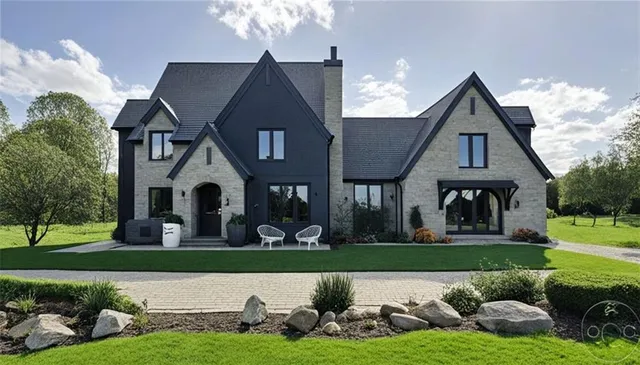 a front view of a house with garden