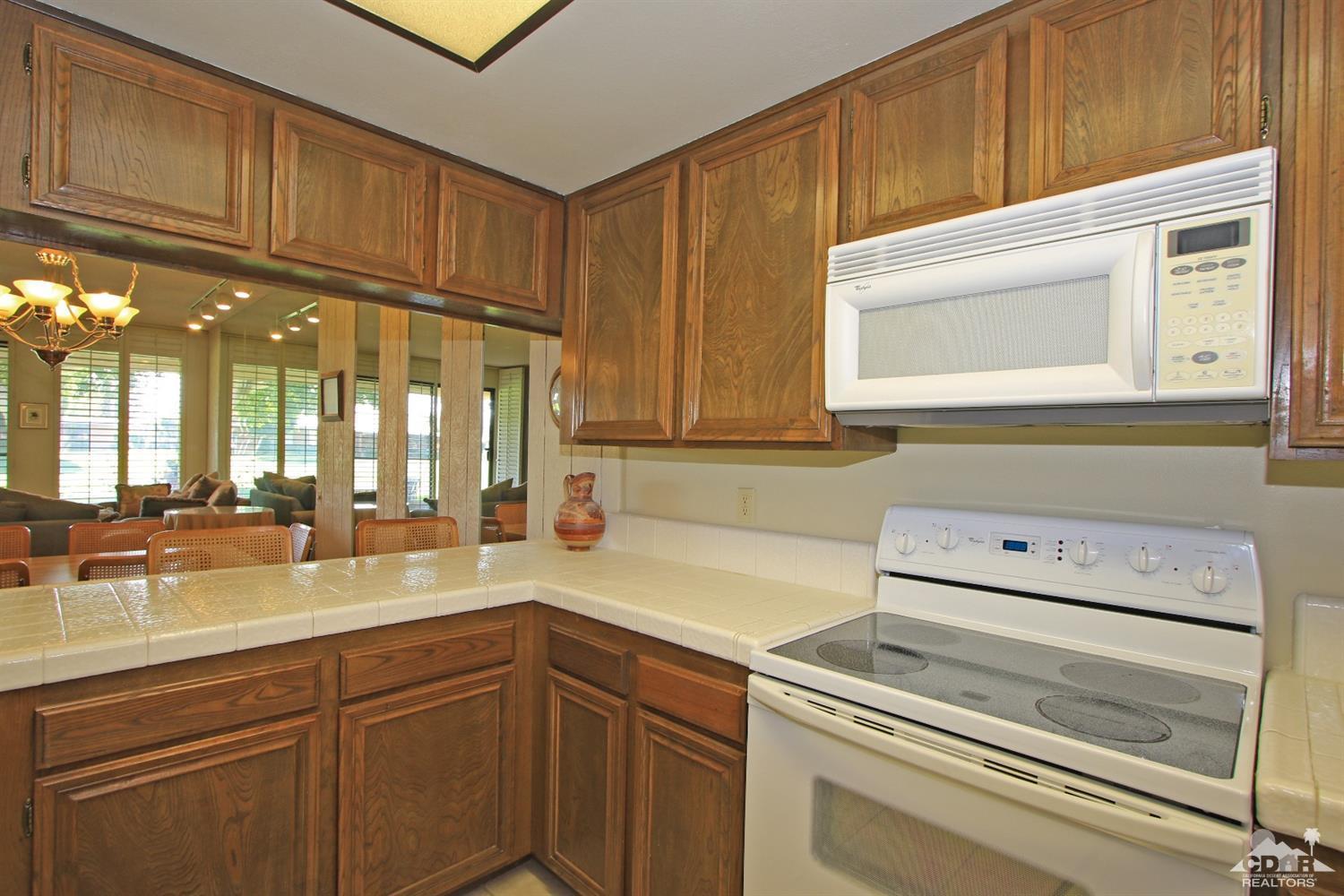 7 Palma Drive Rancho Mirage, CA 92270 - Photo 14 of 33 a kitchen with a sink cabinets and appliances